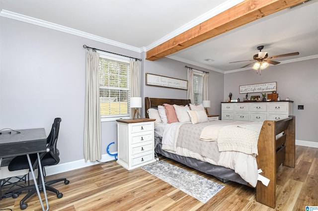 bedroom featuring baseboards, light wood-style flooring, and crown molding