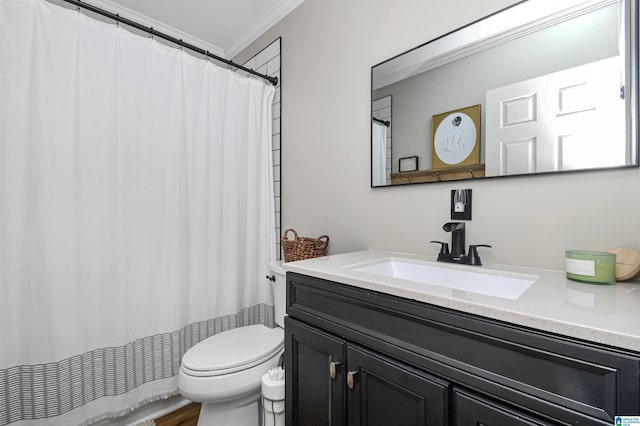 bathroom featuring curtained shower, crown molding, vanity, and toilet