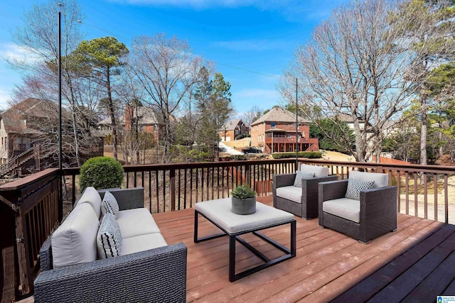 wooden deck featuring an outdoor hangout area