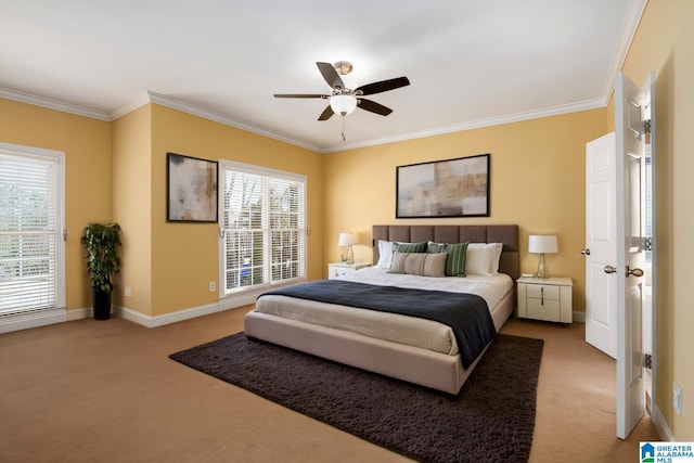 bedroom featuring ceiling fan, baseboards, crown molding, and light colored carpet