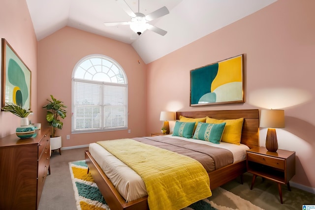 bedroom with carpet floors, baseboards, vaulted ceiling, and a ceiling fan