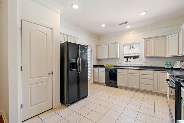 kitchen featuring visible vents, dark countertops, ornamental molding, black appliances, and a sink