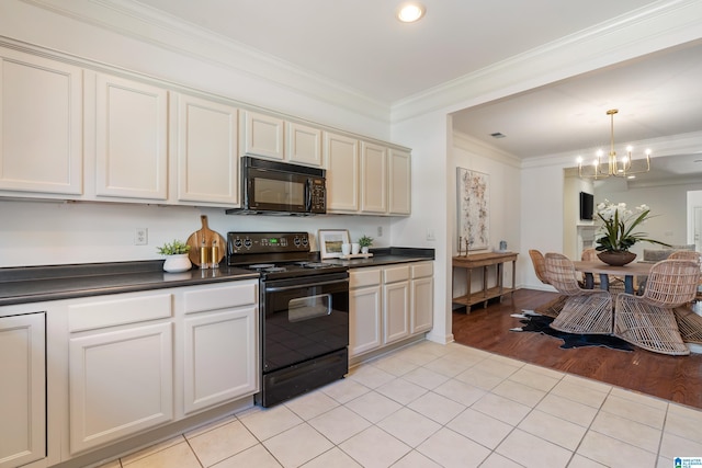 kitchen with dark countertops, crown molding, black appliances, and light tile patterned floors