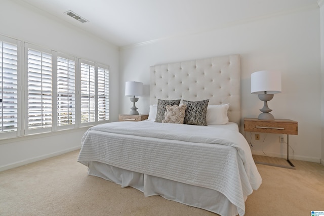 bedroom with carpet, visible vents, and baseboards