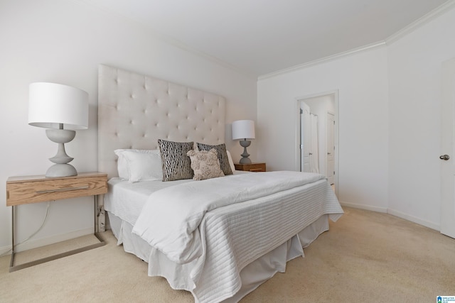 bedroom featuring ensuite bathroom, ornamental molding, carpet flooring, and baseboards