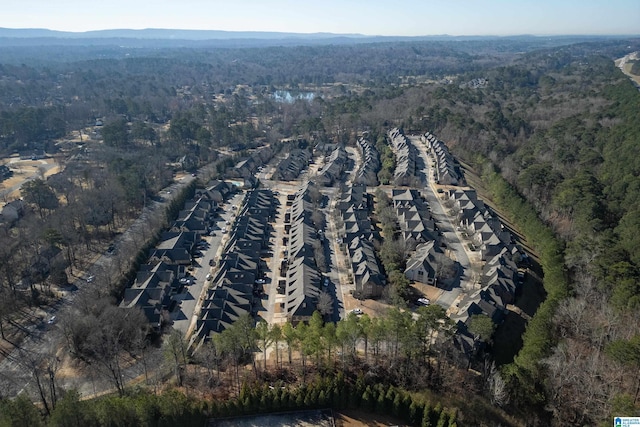 birds eye view of property with a wooded view