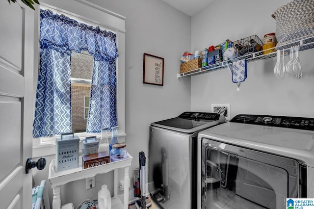 laundry room featuring laundry area, plenty of natural light, and washing machine and dryer