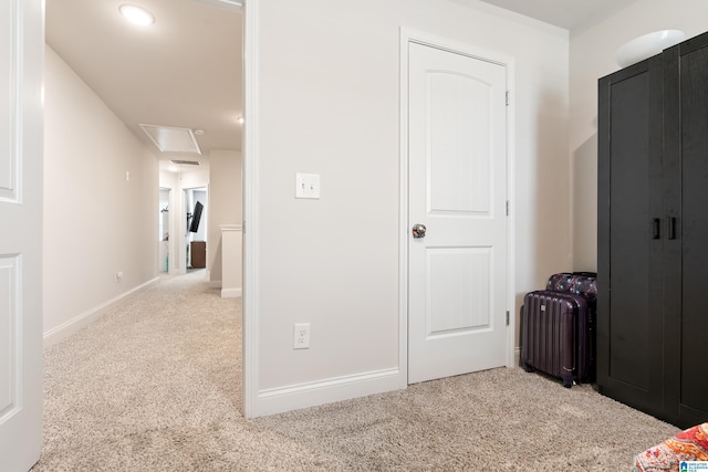 interior space featuring carpet flooring and baseboards