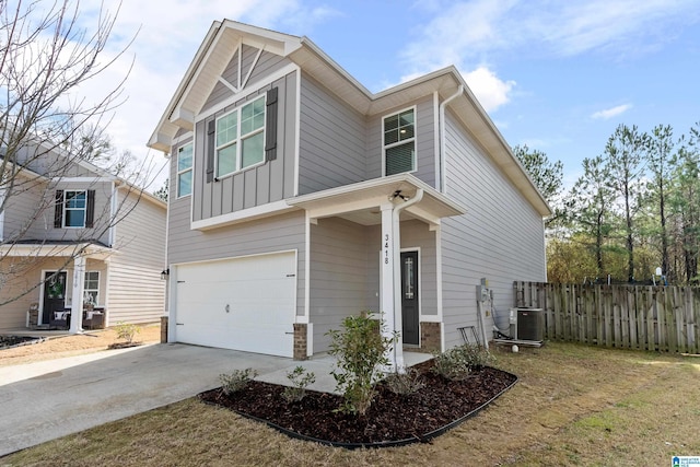 view of front of home with board and batten siding, fence, concrete driveway, cooling unit, and an attached garage