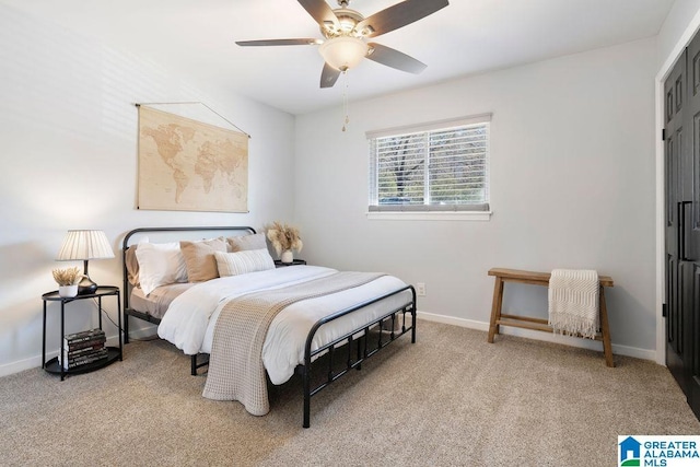 bedroom featuring baseboards, a ceiling fan, and light colored carpet