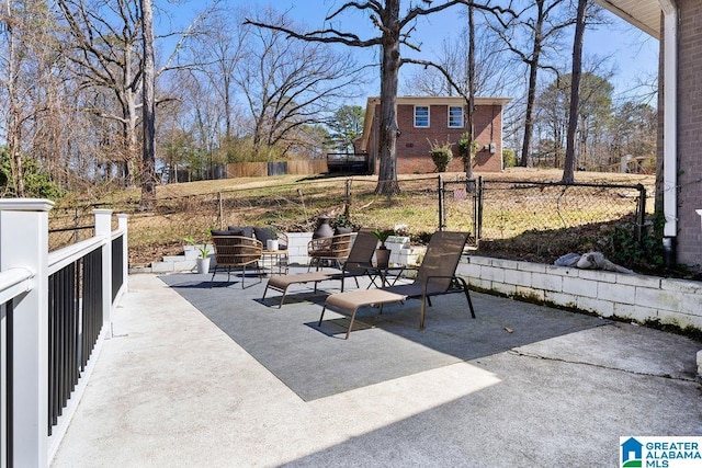 view of patio with outdoor lounge area and fence