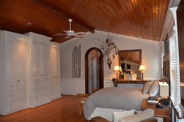 bedroom featuring lofted ceiling, light wood finished floors, wood ceiling, and arched walkways