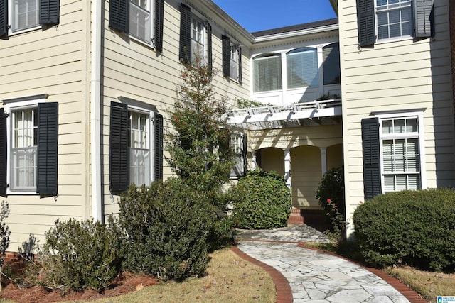 view of home's exterior featuring a pergola