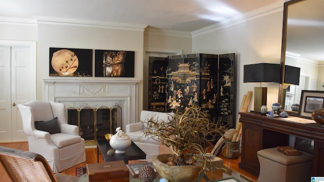 living room featuring ornamental molding, a high end fireplace, and wood finished floors