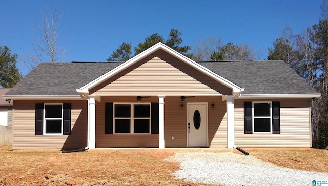 single story home featuring a shingled roof