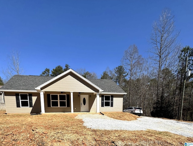 view of front of home with a shingled roof