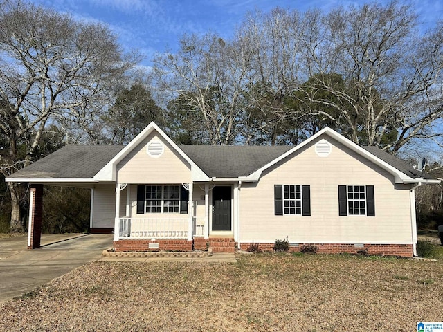 single story home with covered porch, concrete driveway, a front yard, crawl space, and an attached carport