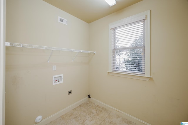 laundry room with laundry area, visible vents, baseboards, hookup for an electric dryer, and washer hookup