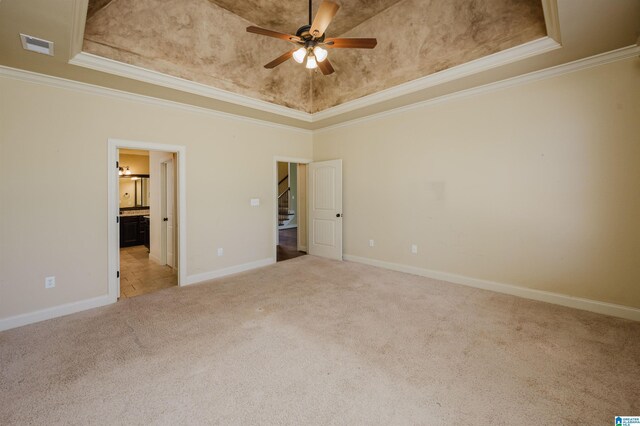 unfurnished bedroom featuring carpet floors, visible vents, ornamental molding, and baseboards