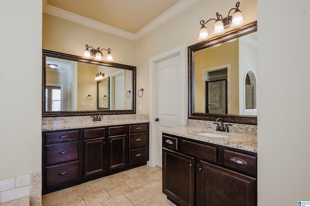 full bathroom with two vanities, a sink, and crown molding