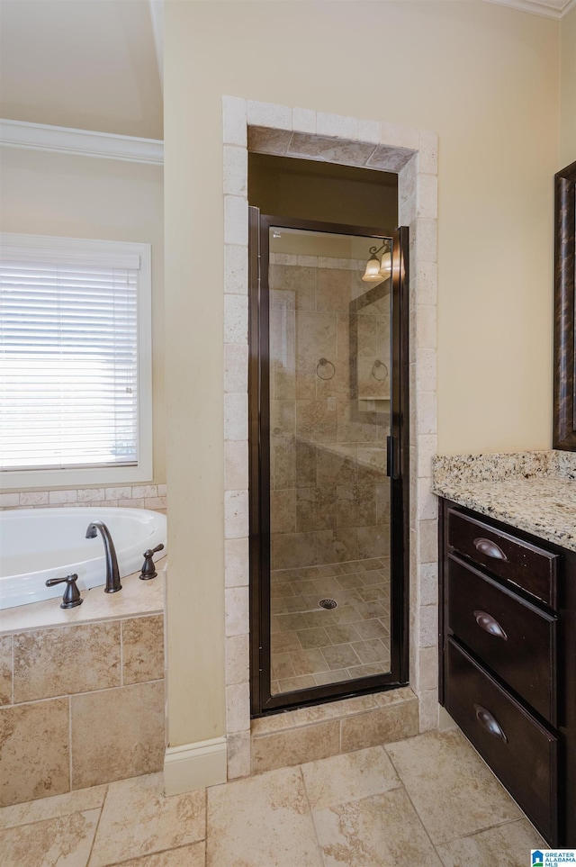 bathroom featuring ornamental molding, a stall shower, and a bath