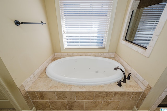 full bathroom with a jetted tub