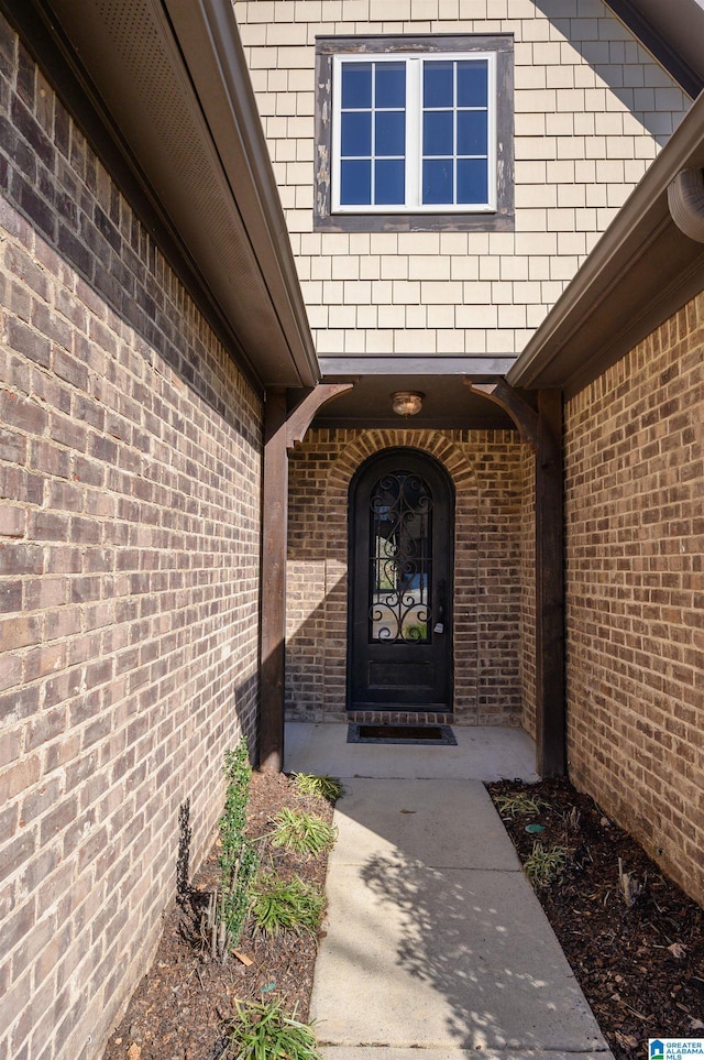 entrance to property with brick siding