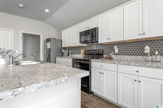 kitchen featuring white cabinets, a sink, backsplash, and black appliances