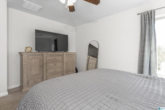 bedroom featuring baseboards, visible vents, ceiling fan, and carpet flooring