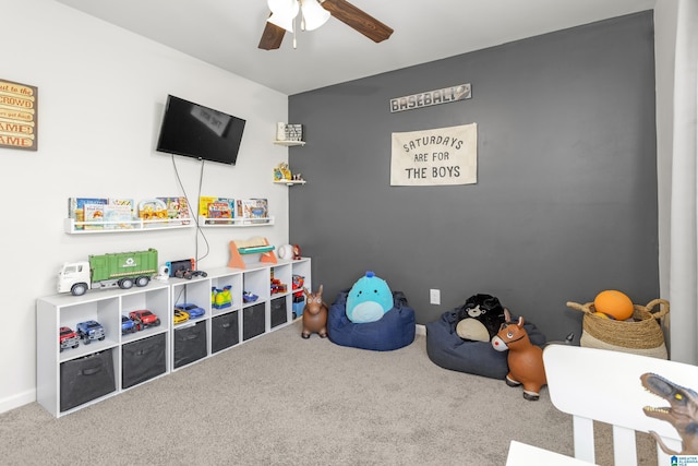 rec room with carpet and ceiling fan