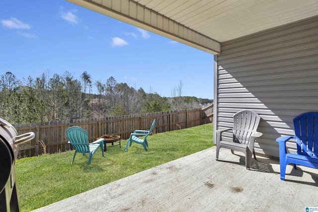 view of patio / terrace featuring an outdoor fire pit, a fenced backyard, and a grill