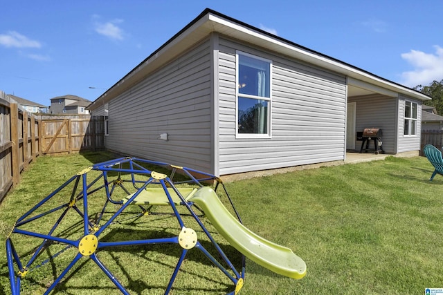 view of home's exterior featuring a yard and a fenced backyard