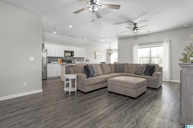 living room with a ceiling fan, recessed lighting, dark wood finished floors, and baseboards