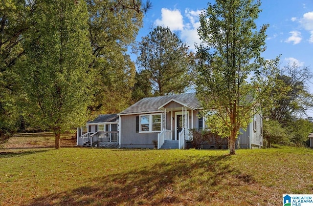 view of front of home with a front yard and crawl space