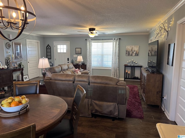 dining area featuring dark wood-style floors, ornamental molding, a textured ceiling, and plenty of natural light