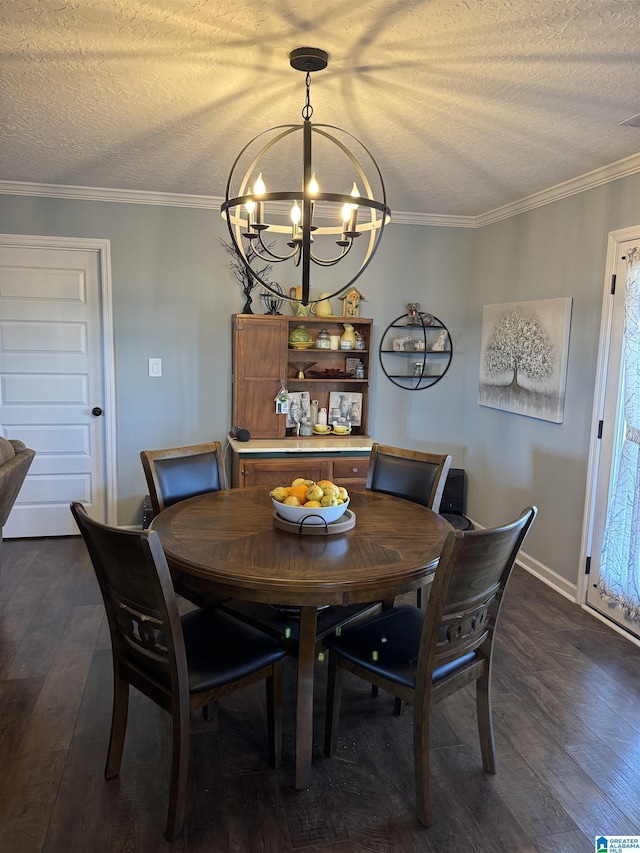 dining space featuring a chandelier, a textured ceiling, baseboards, ornamental molding, and dark wood-style floors