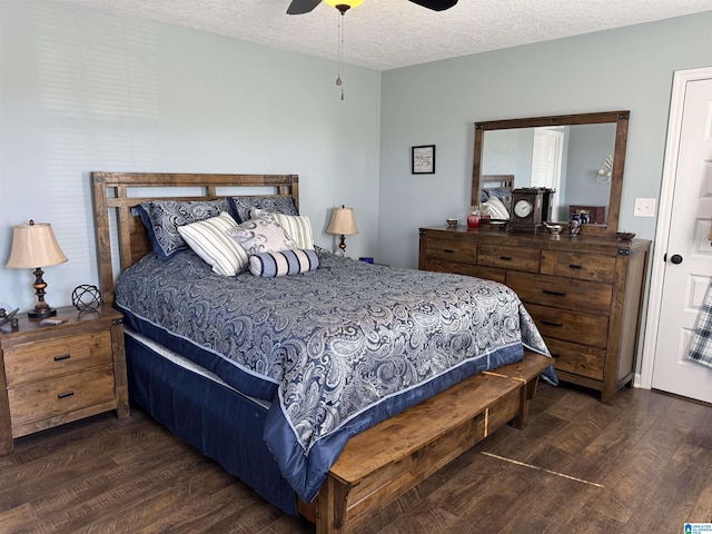 bedroom with a ceiling fan, a textured ceiling, and wood finished floors