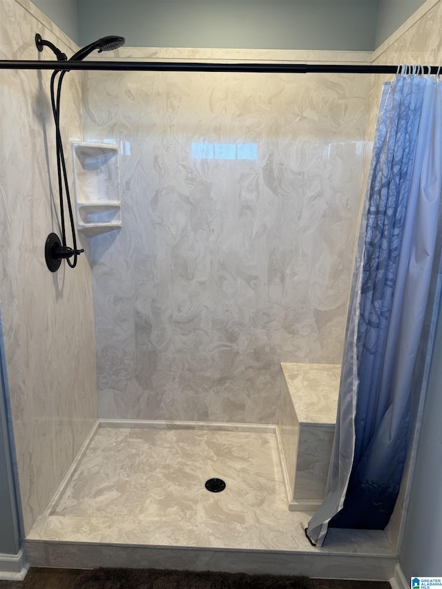 bathroom featuring curtained shower