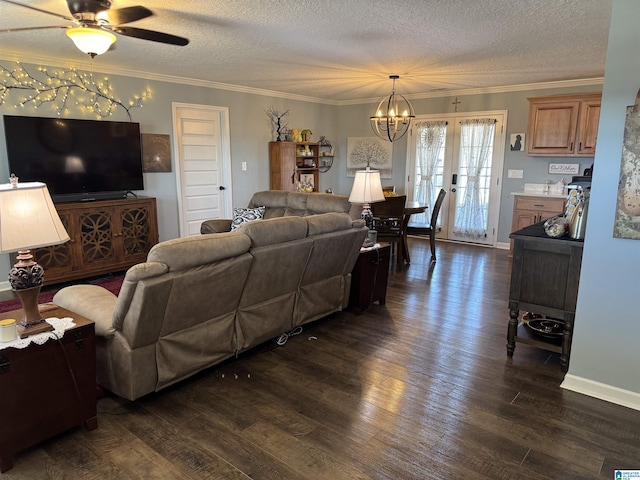 living area featuring dark wood-type flooring, french doors, crown molding, and a textured ceiling