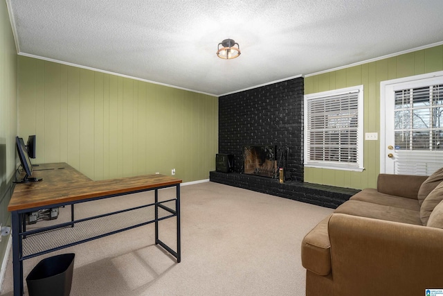 living area featuring ornamental molding, carpet, a brick fireplace, and a textured ceiling