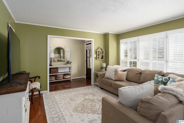 living room with baseboards, a textured ceiling, ornamental molding, and dark wood-type flooring