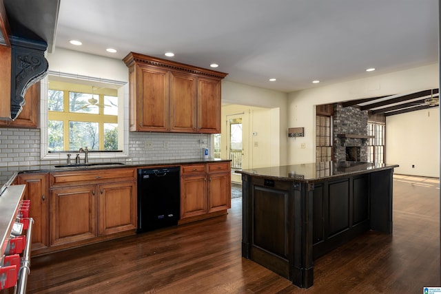 kitchen with a sink, decorative backsplash, dishwasher, and dark wood-style floors