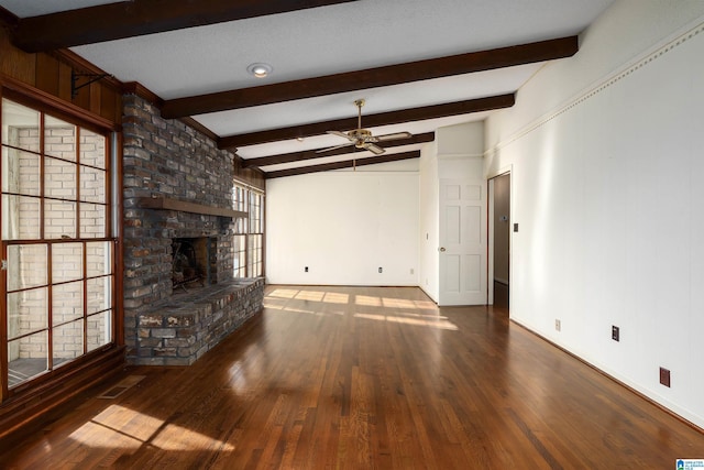 unfurnished living room with baseboards, a brick fireplace, wood finished floors, and a ceiling fan