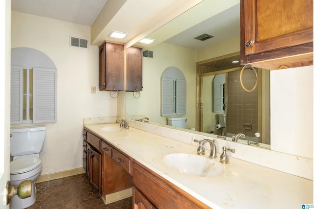 bathroom with a sink, visible vents, toilet, and a stall shower