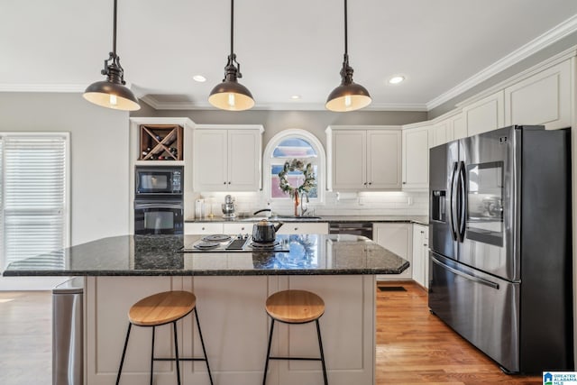 kitchen featuring white cabinetry, crown molding, and black appliances