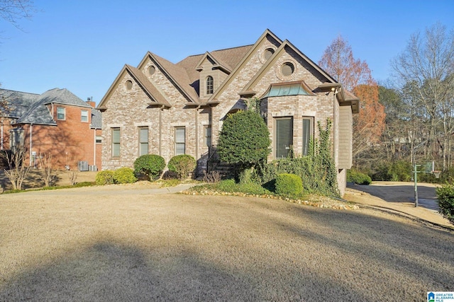 view of front of house featuring brick siding