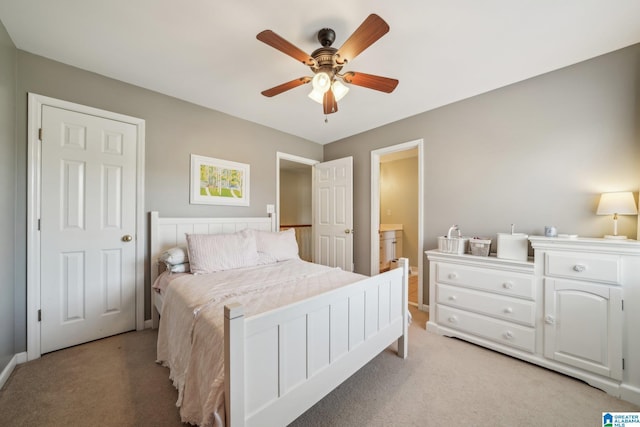 bedroom featuring light colored carpet and ceiling fan