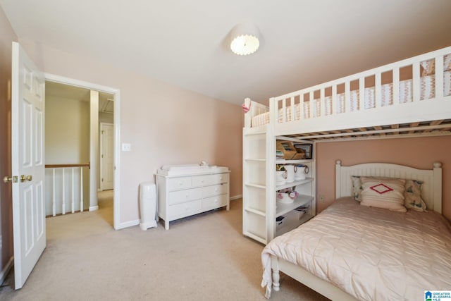 carpeted bedroom featuring baseboards