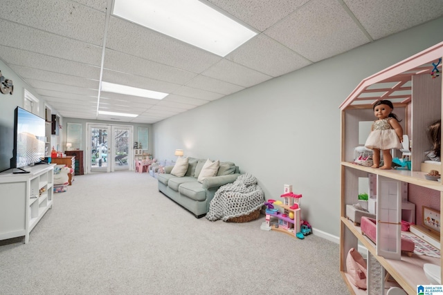 game room featuring carpet floors and a drop ceiling