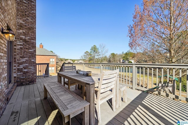 wooden deck featuring outdoor dining space